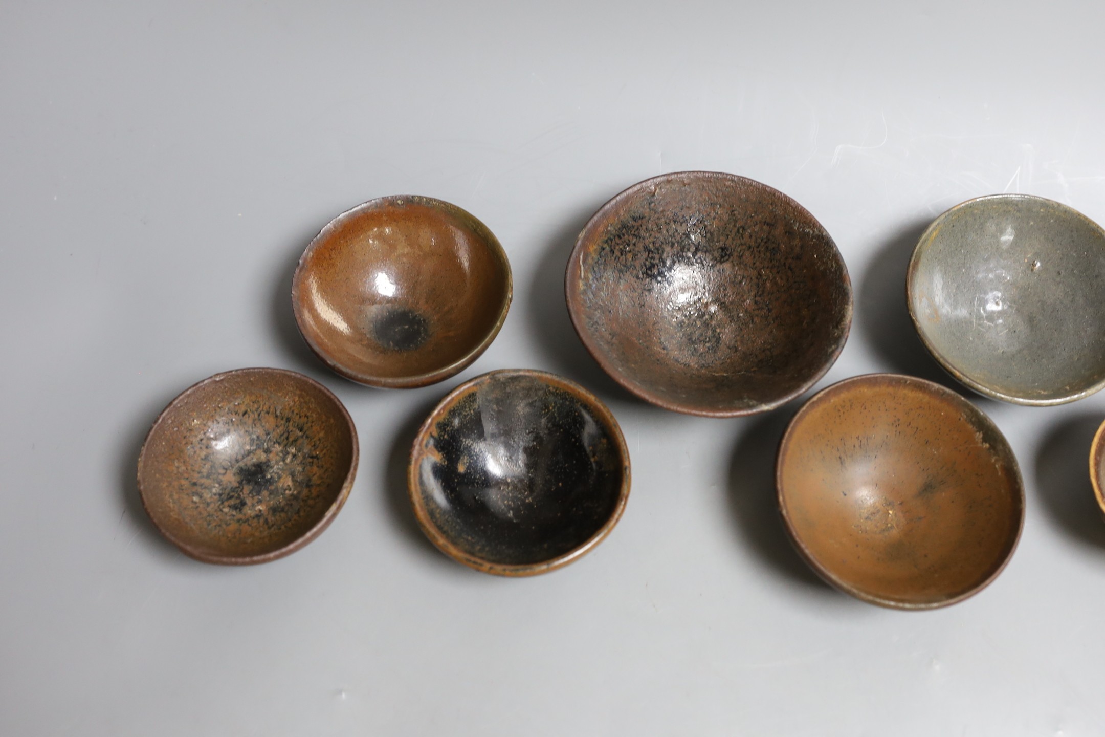 A group of Chinese Jian ware tea bowls, Song dynasty, largest 11.5 cms diameter, 7cm to 11.4cm diameter